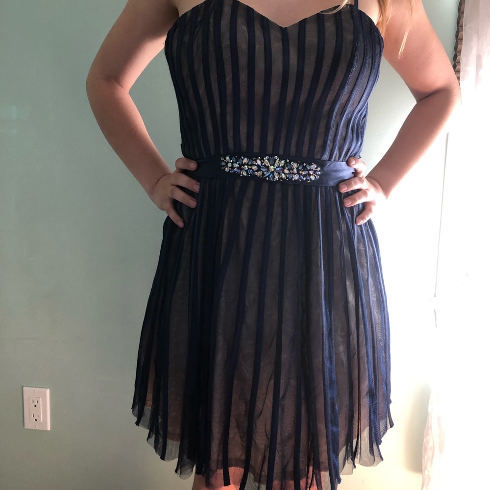 Navy blue striped dress with jeweled belt.